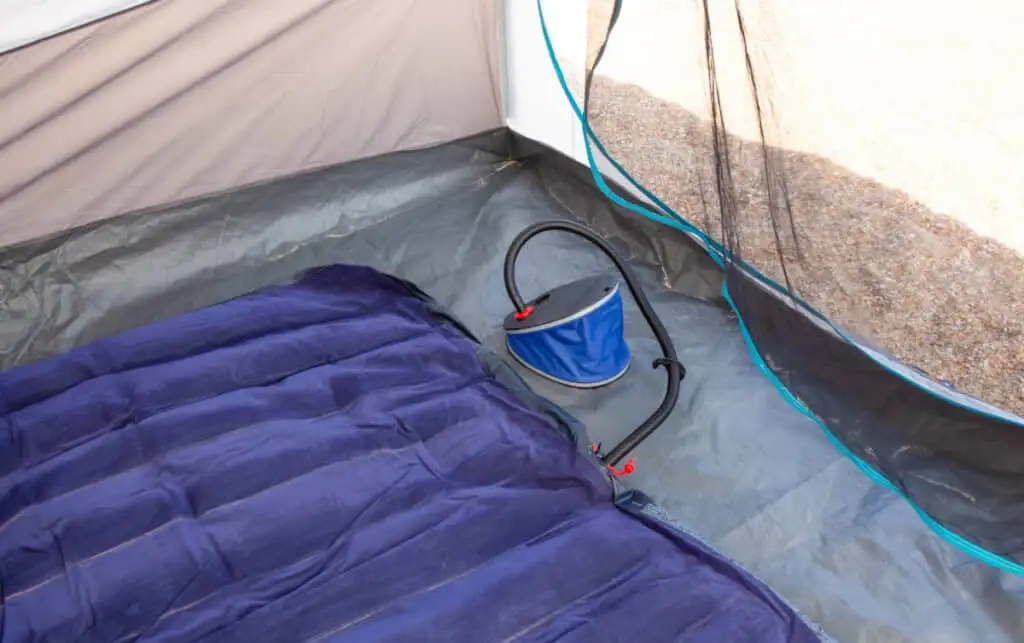 How do you stay warm on a camping air mattress?